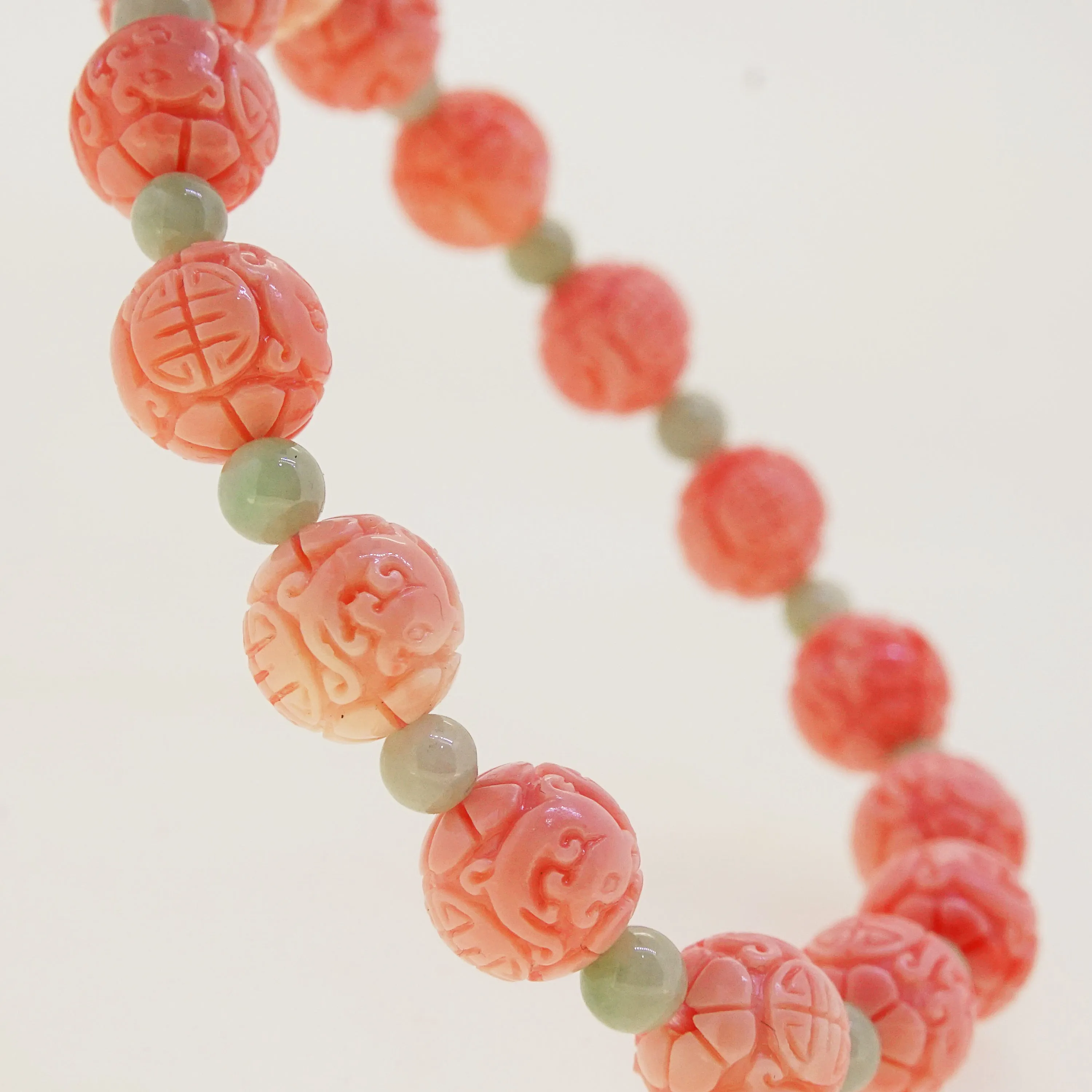 Carved Peach Japanese Coral with Burma Jade 4mm