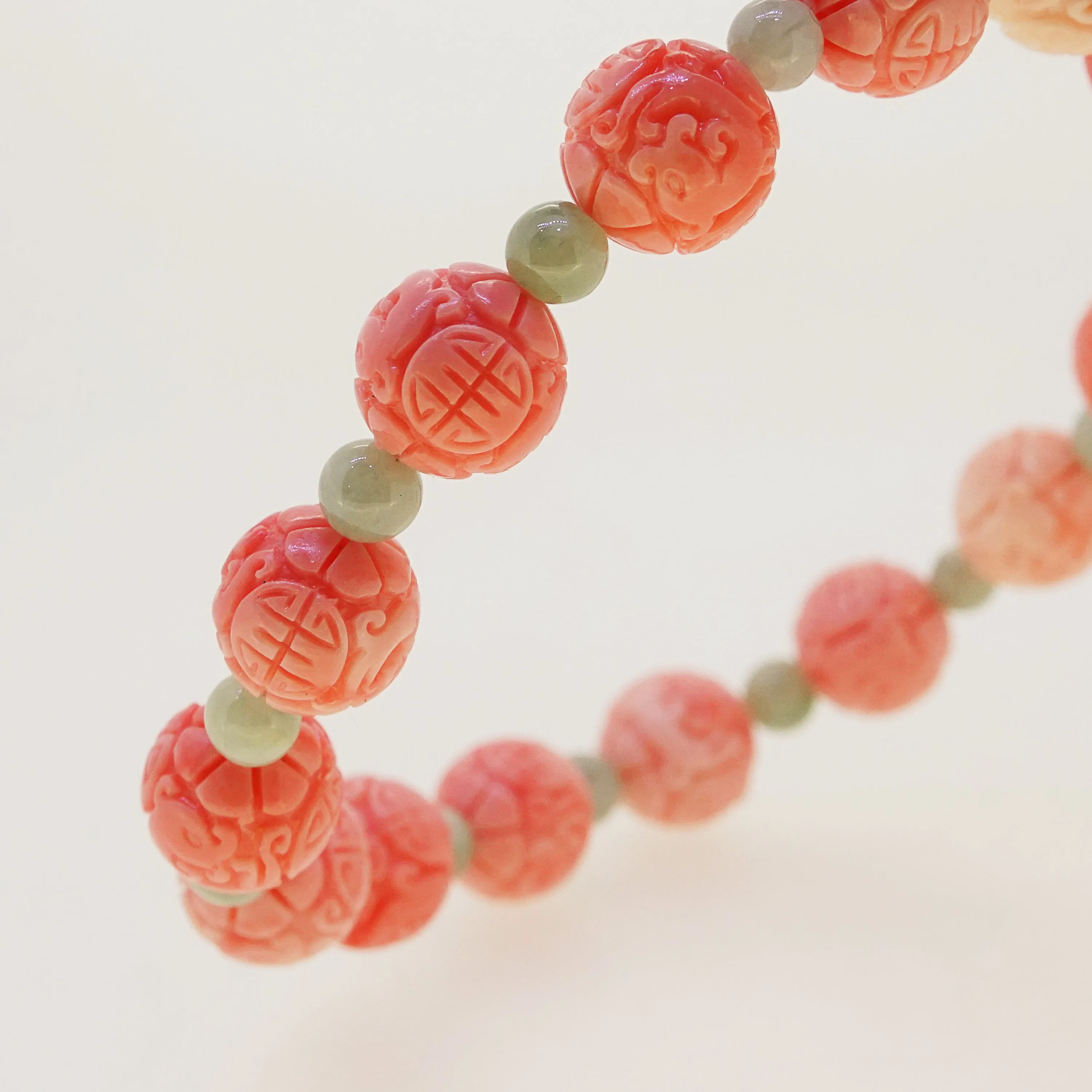 Carved Peach Japanese Coral with Burma Jade 4mm