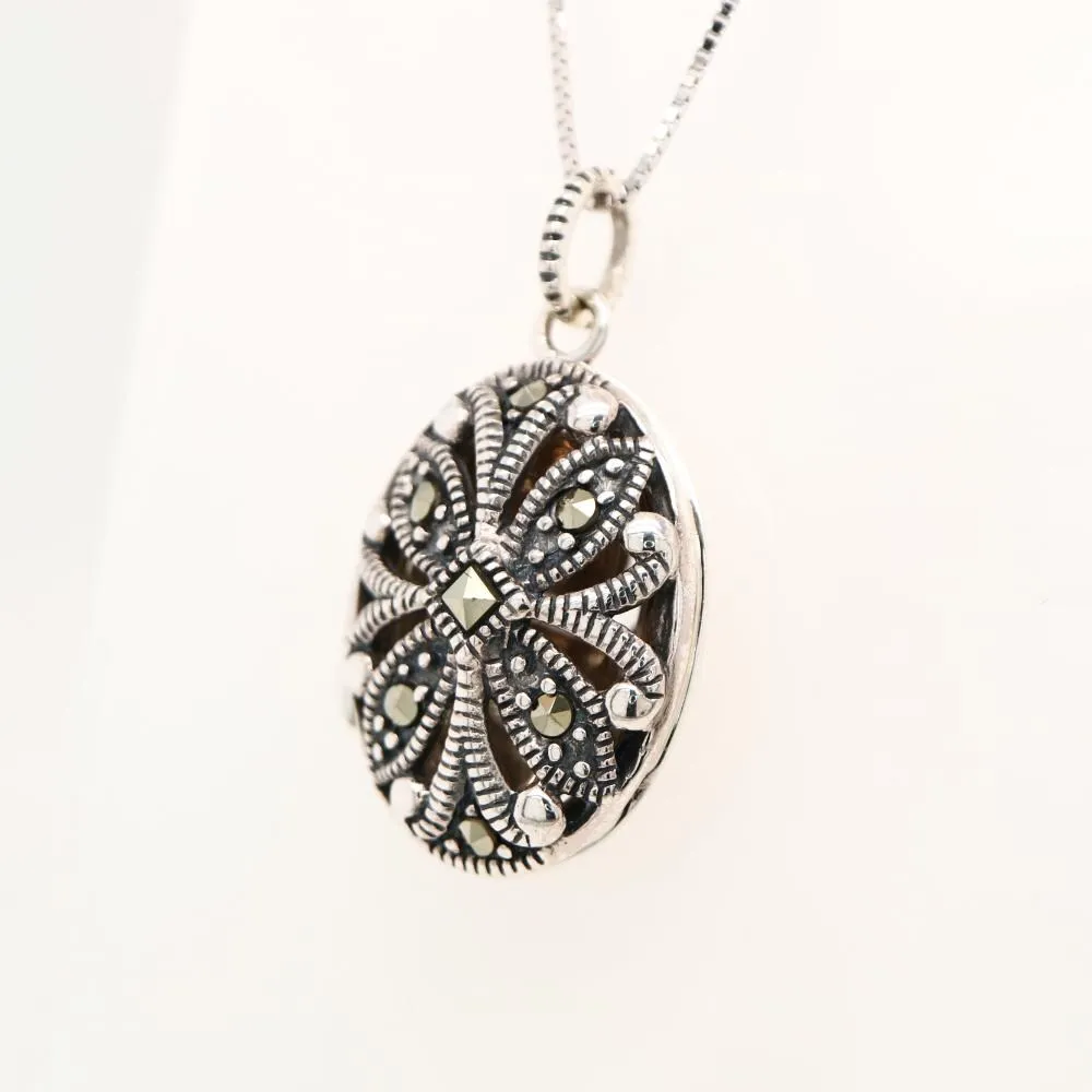 Flower locket in sterling silver with marcasite