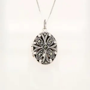 Flower locket in sterling silver with marcasite